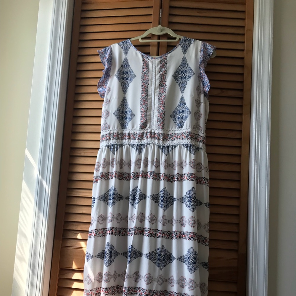 Dress with ruffle sleeve and eyelet overlay trim